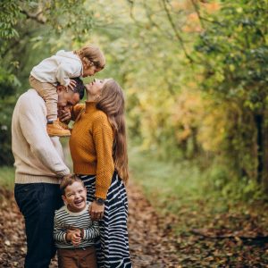 Young family with children in autumn park